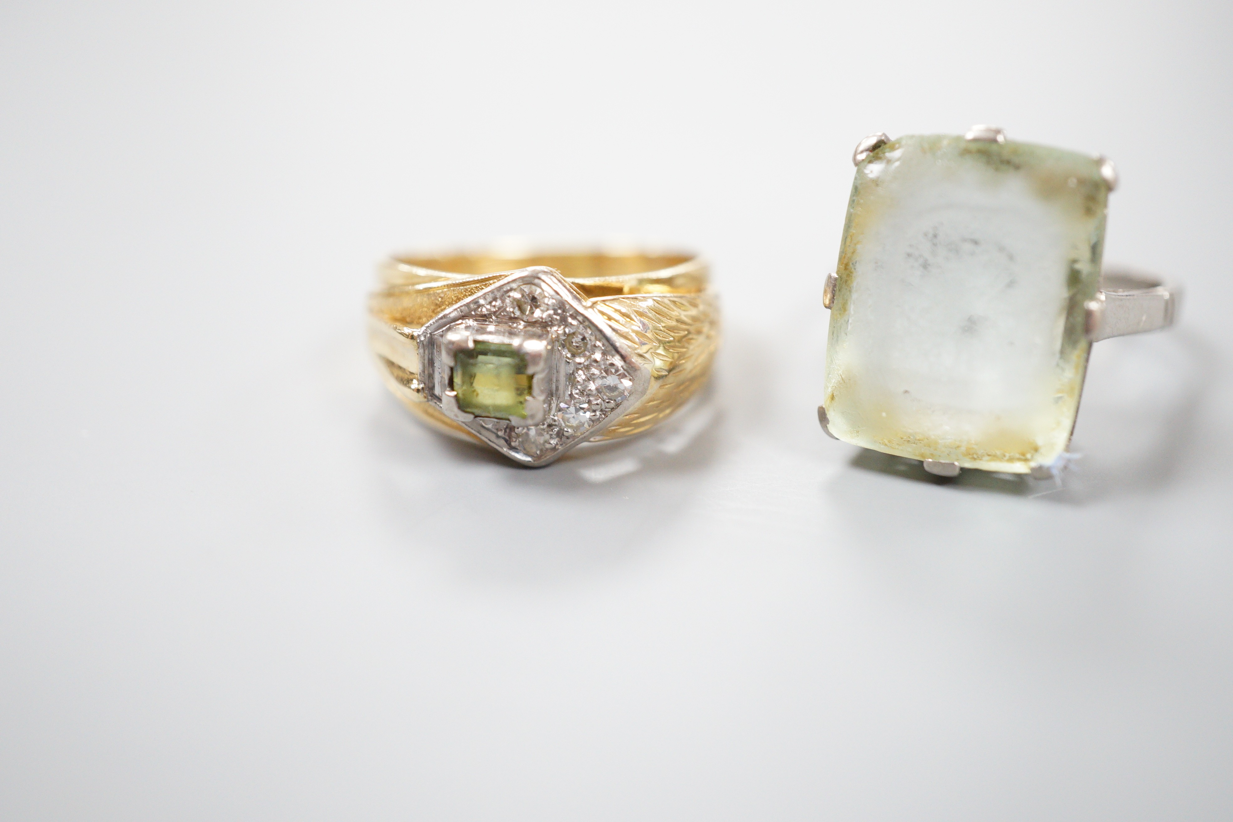An 18ct white metal and paste set ring, gross 6.1 grams, and one other continental diamond and tourmaline? set cluster ring, stamped 8ct, gross 5.9 grams.